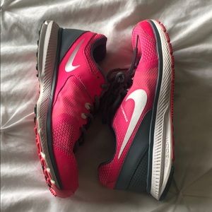 Bright pink nike workout shoes
